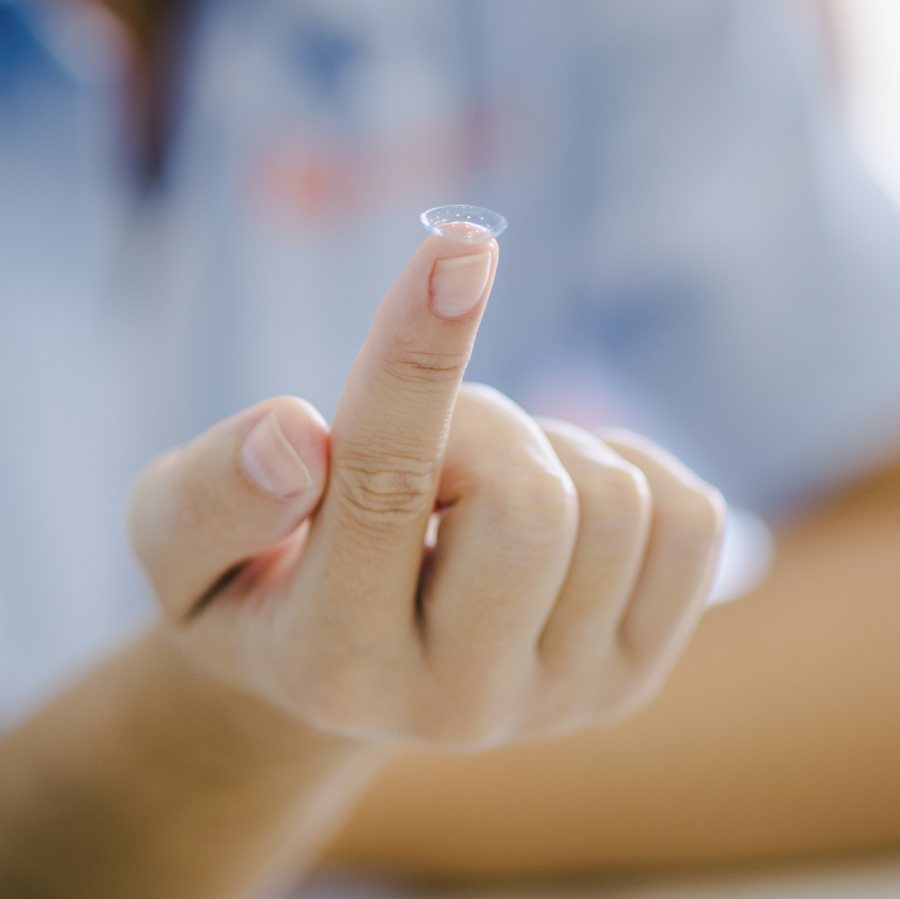 Contact lens on a fingertip