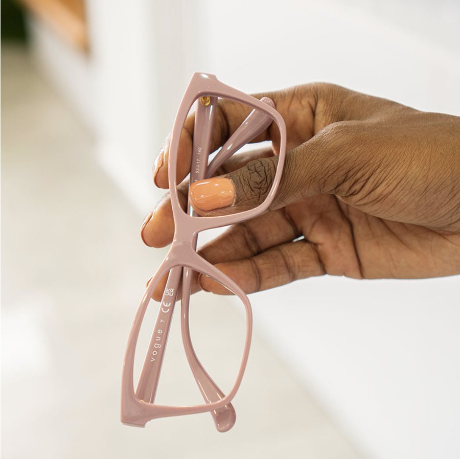Hand holding pink frames